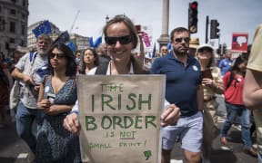 A protester holds a signs expressing her concerns regarding the Irish border at the people's vote march in London, United Kingdom where thousands rallied to protest against Brexit on June 23 and ask for a referendum on the final Brexit deal.