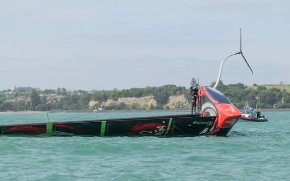 Emirates Team New Zealand capsize on the Waitemata Harbour.