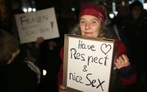 A woman in Cologne protests against sexism, following a mass sexual assault in the city on New Year's Eve.