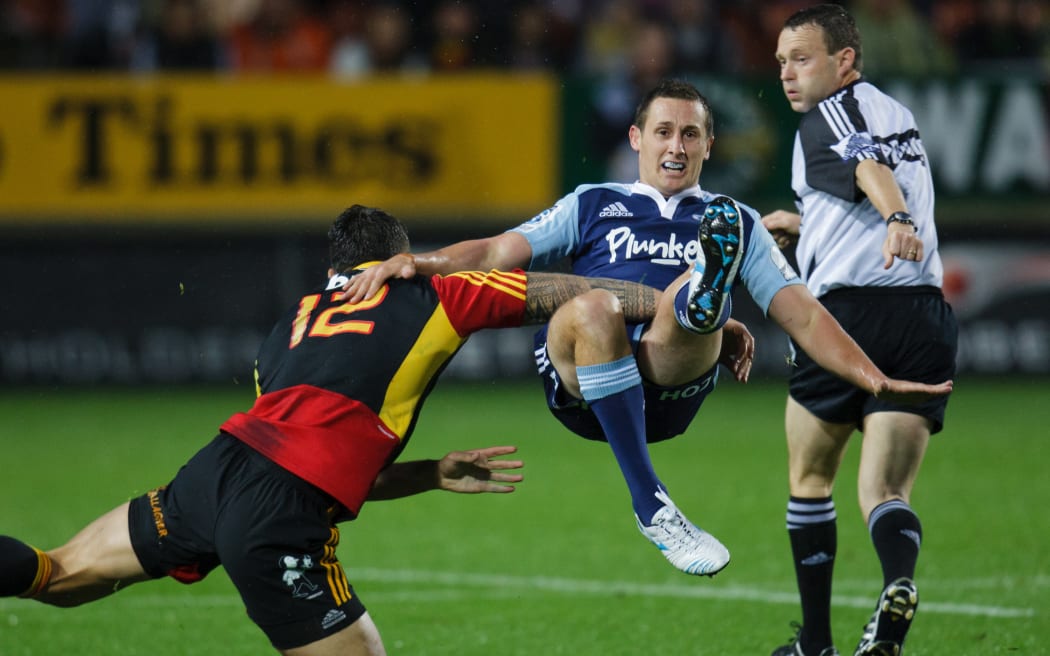 Blues' Michael Hobbs tackled by Sonny Bill Williams during the 2012 Super Rugby season, Chiefs v Blues match at Waikato Stadium, Hamilton, New Zealand, Friday 2 March 2012.