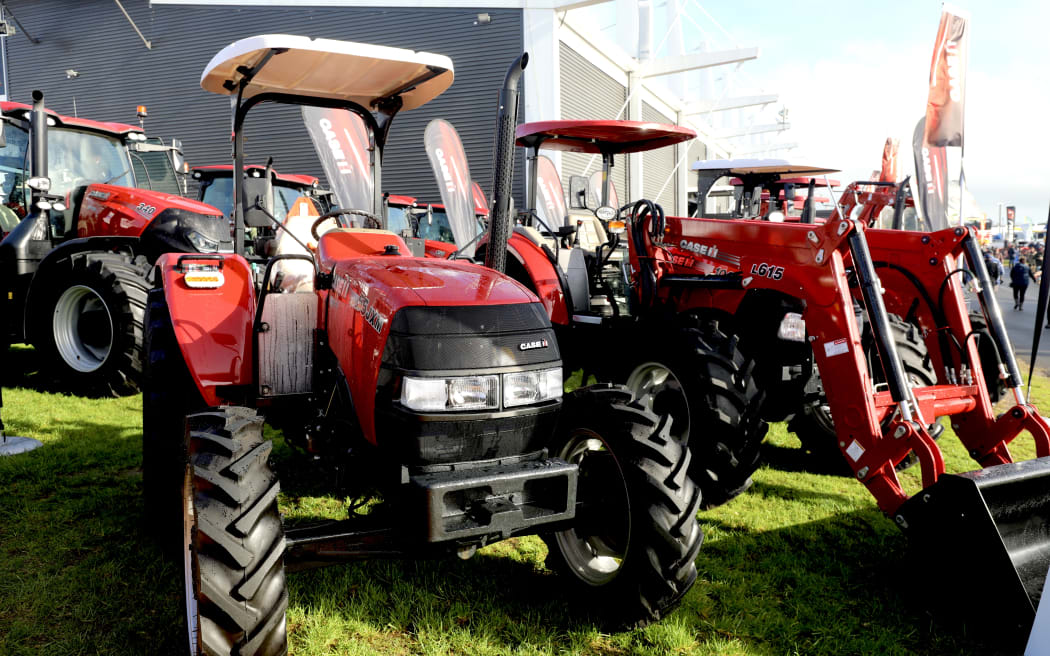 The government's tax reduction will make it appealing for farmers with older tractors to upgrade them, dairy farmers Christian Allen and Anna Maley say.