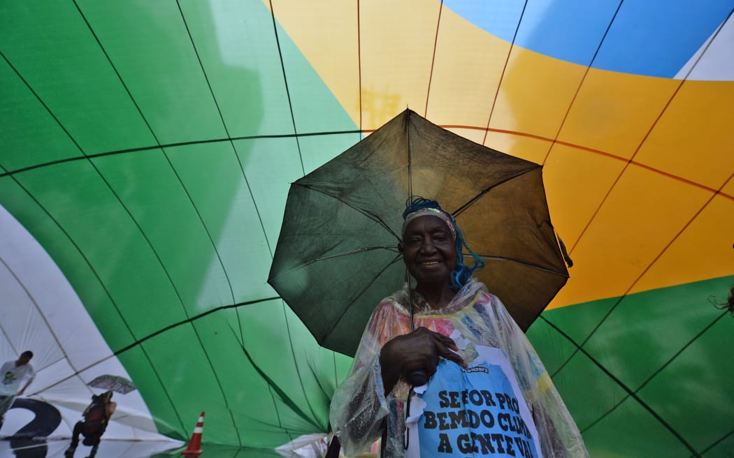 A woman takes part in the Global Climate March in Sao Paulo, Brazil.