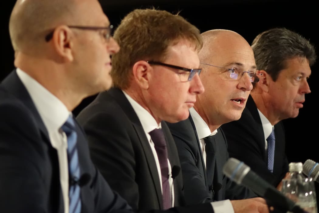 Fonterra chief executive Theo Spierings, second from right, announcing the profit fall.