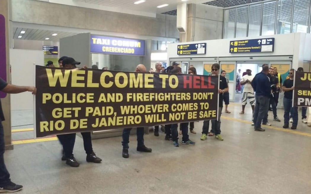 Police and firefighters protest poor conditions at Rio de Janeiro International Airport.