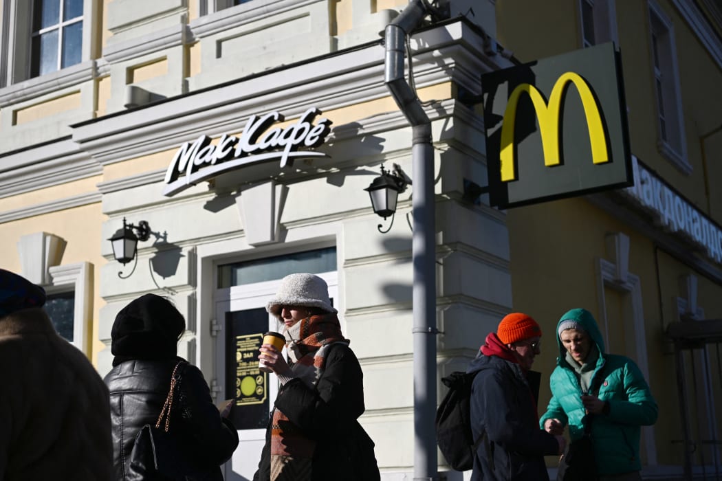 People outside a McDonalds in Moscow, before the company closed all restaurants in Russia.