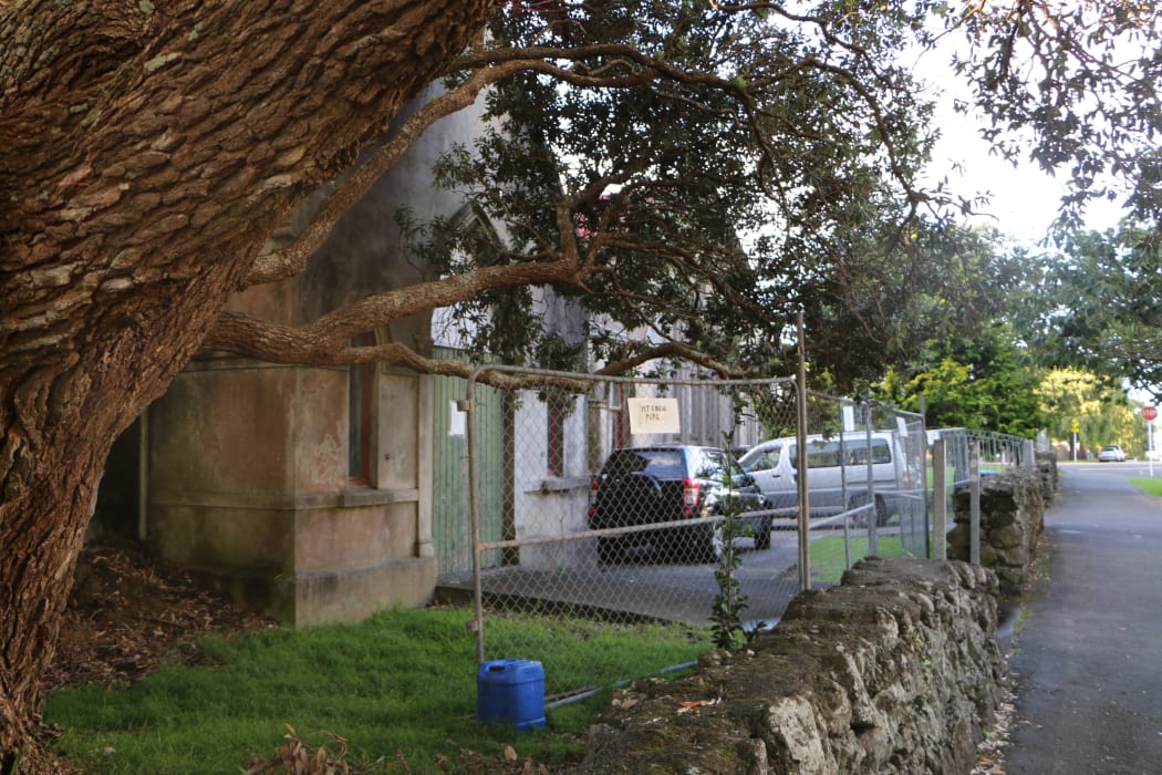 The hall's east side is just metres away from the footpath
