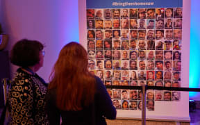 14 December 2023, Berlin: A poster with photos of the Hamas hostages can be seen at the Jewish Community Day 2023 at the Intercontinental Hotel. From December 14 to 17, the Central Council of Jews in Germany is inviting members of Jewish communities from all over Germany to the Community Day in Berlin, which this year is being held under the motto "Living Together". Photo: Joerg Carstensen/dpa (Photo by Jörg Carstensen / DPA / dpa Picture-Alliance via AFP)