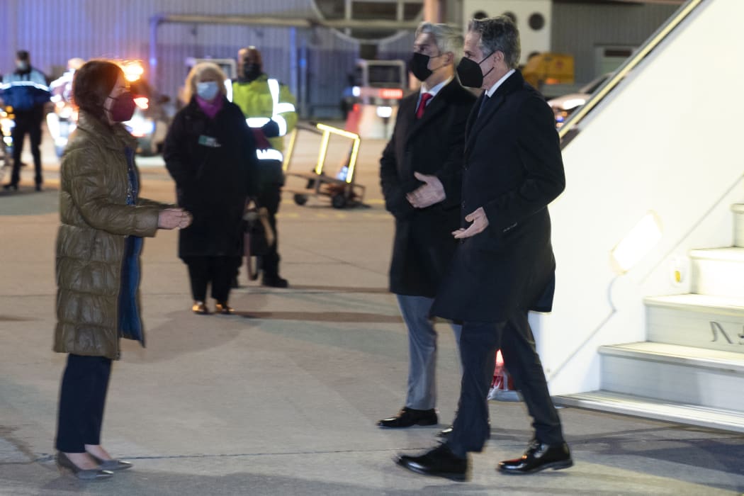 US Secretary of State Antony Blinken (R) is greeted by Ambassador Bathsheba Crocker (L) at Geneva Airport, Switzerland.