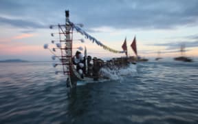 A traditional war canoe, Tomoko, from Roviana in the Western Solomons participates in the Pacific flotilla at the opening of the 11th Festival of Pacific Arts in Honiara. June 2012