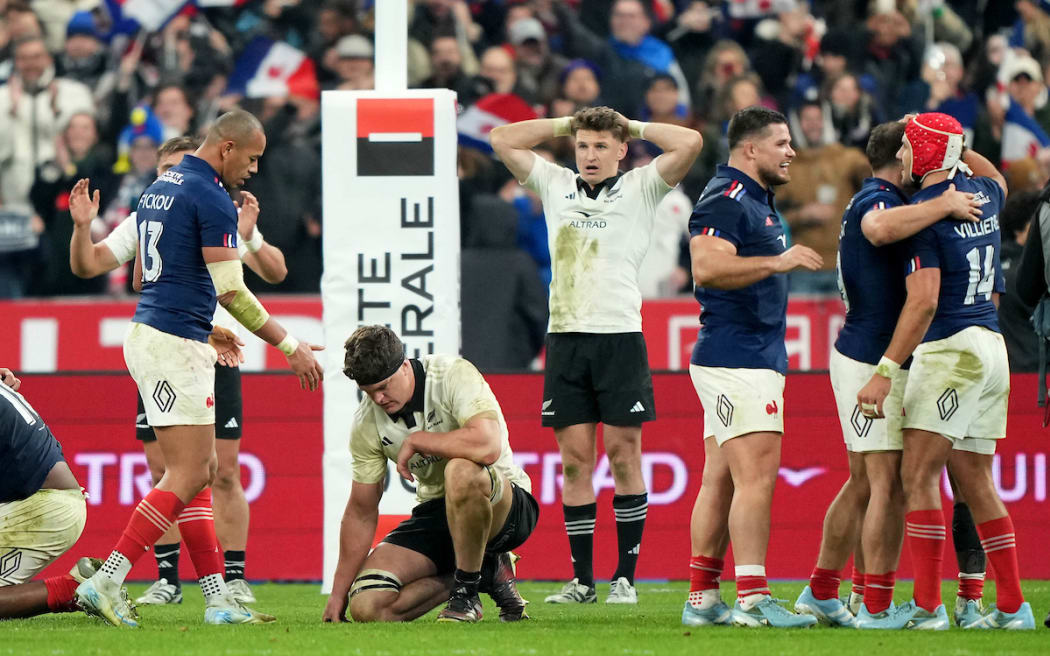 New Zealand's Scott Barrett and Beauden Barrett dejected after the loss to France.
