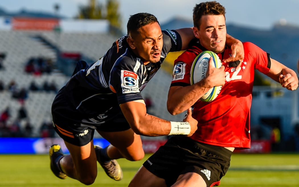 Will Jordan scores in the tackle of Toni Pulu