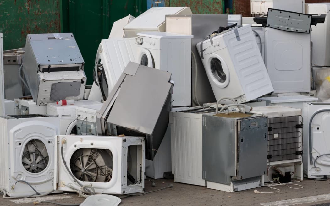 Collected and awaiting for the disposal of electronic-waste - refrigerators, washing machines and others. Close-up