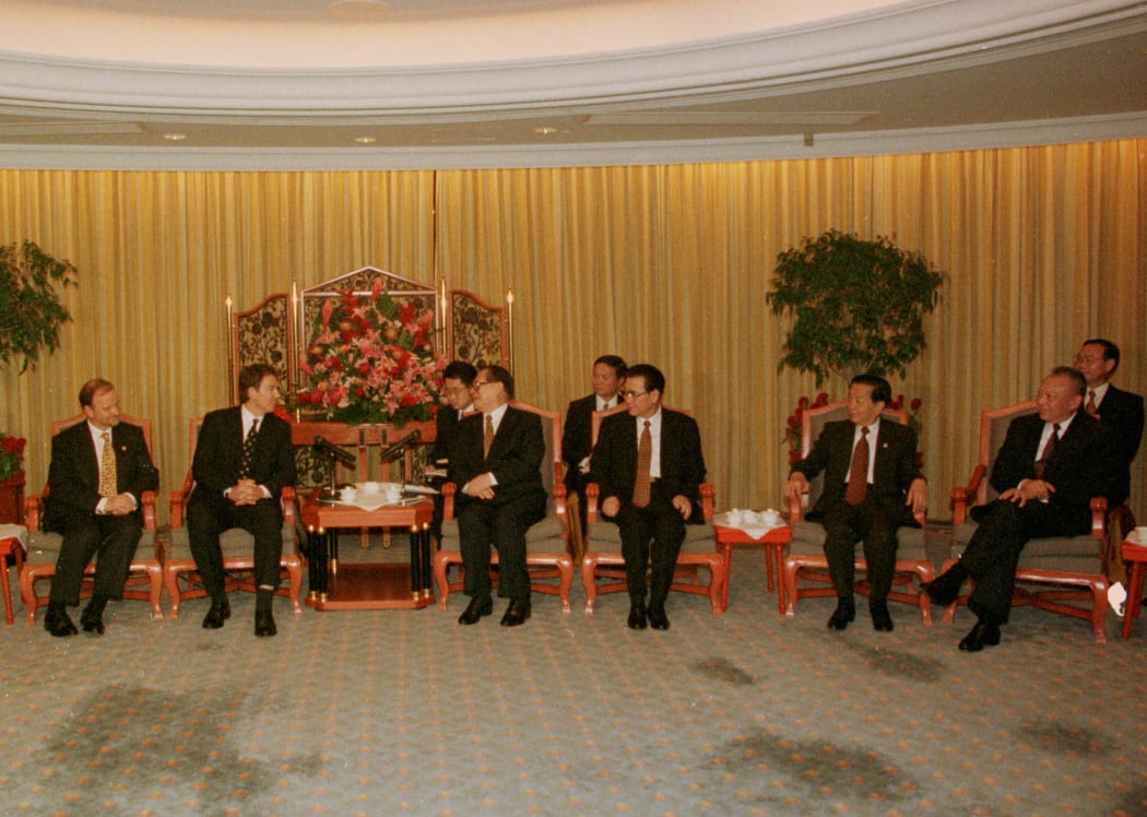 Chinese and British leaders meet in Hong Kong on 30 June 1997.