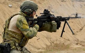 A soldier of the Russian Interior Ministry shoots with a weapon during the All-Russian shooting competition "Forever Alive" in Saint Petersburg on August, 25, 2022.