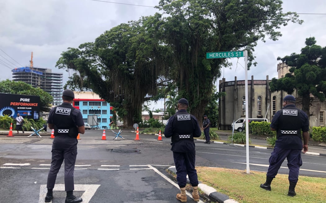 Police survey the streets of Suva