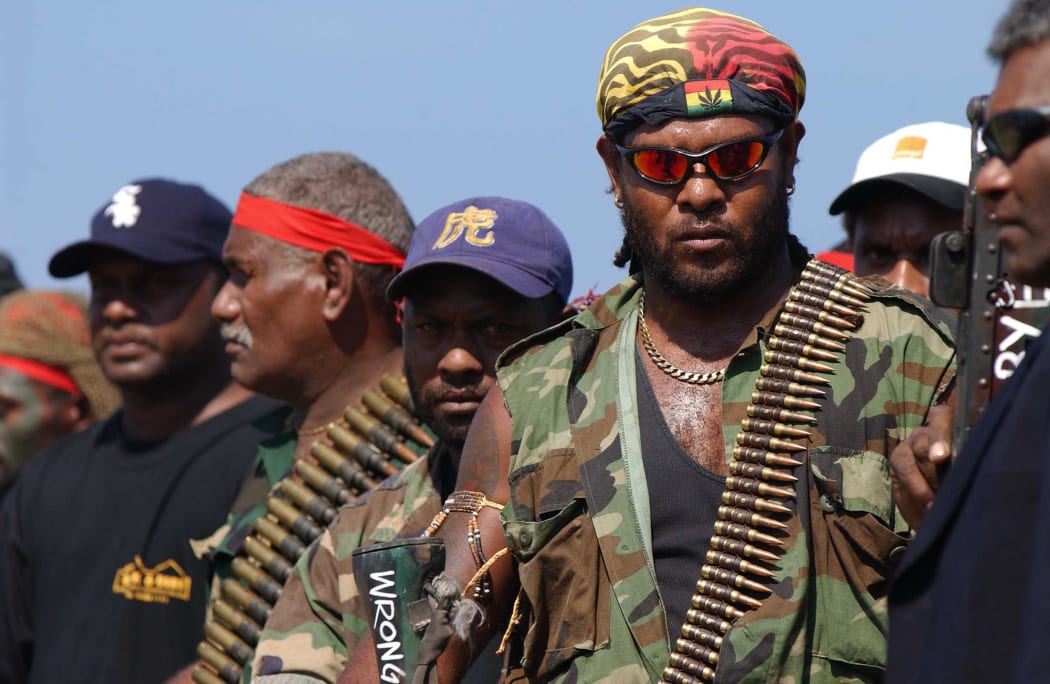 Militants surrender arms in 2003