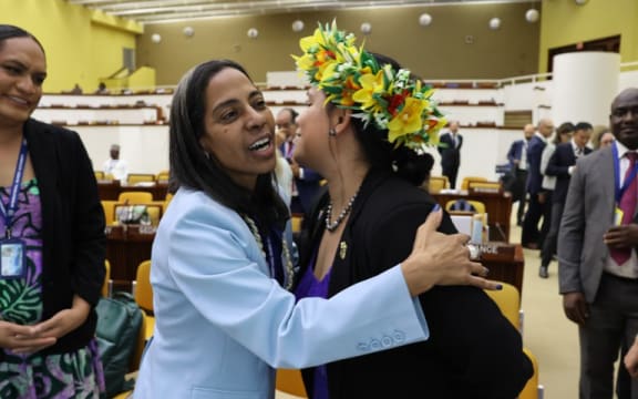 International Seabed Authority secretary-general elect, Leticia Carvalho [left] of Brazil, is congratulated by a member of the Cook Islands delegation following her election on Aug. 2, 2024 in Kingston, Jamaica.