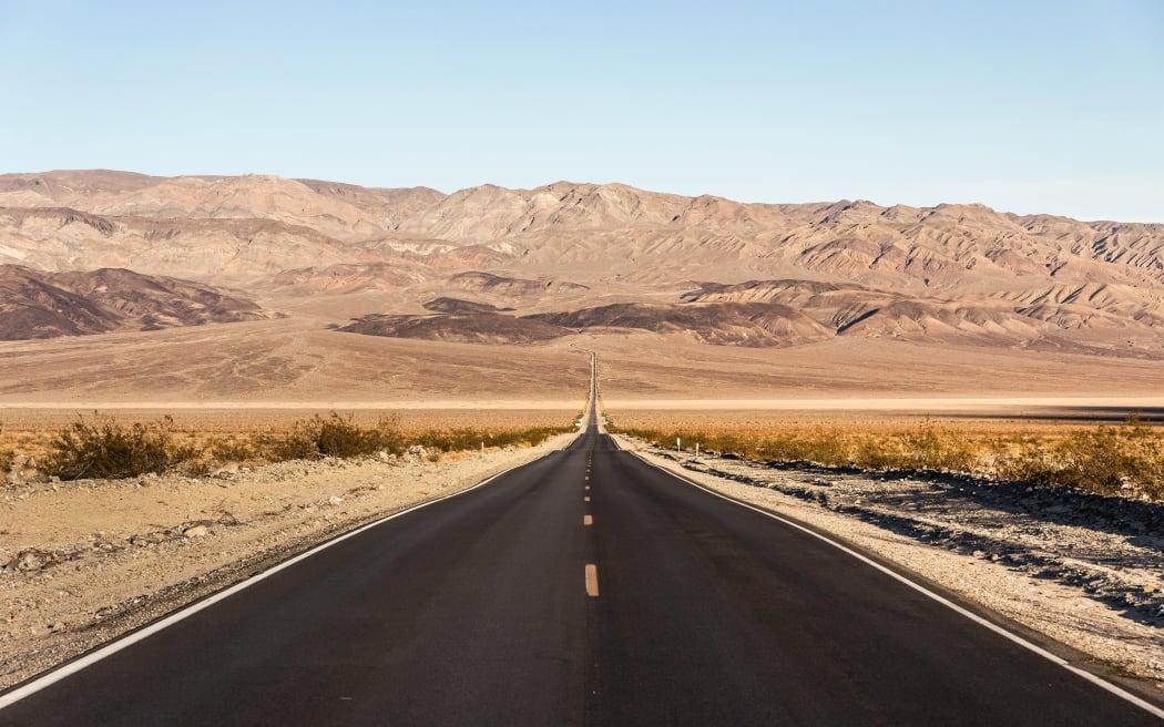 Landscape with straight road in Death Valley National Park, California, USA