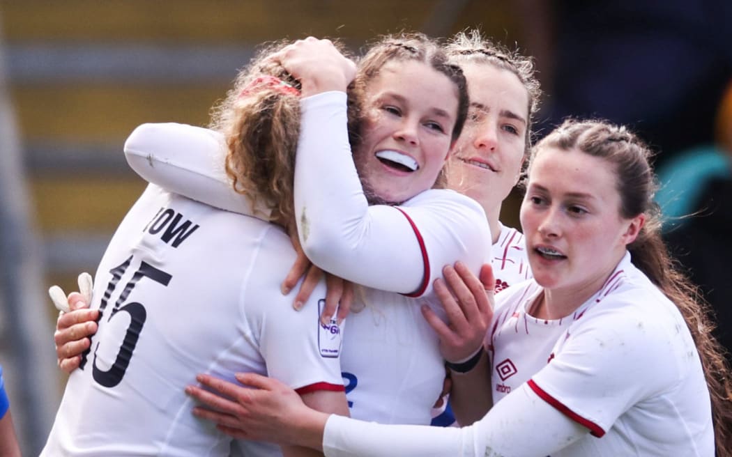 The England Roses celebrate a try.
