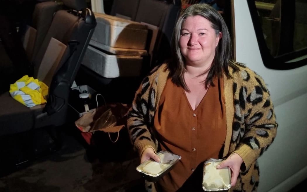 Social worker Mel Mitchell prepares to deliver hangi.