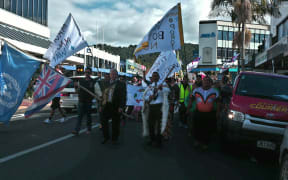 Protestors march through Whangarei to voice their disagreement with plans to allow Zodiac Holdings to build a water bottling factory at Porotī Springs.