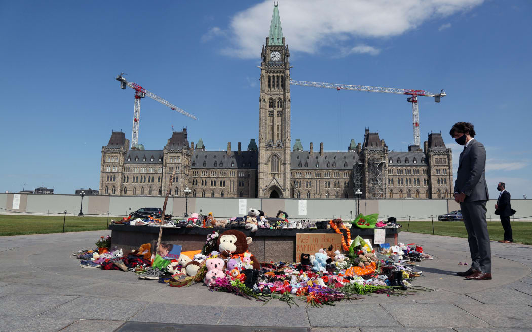Canadian Prime Minister Justin Trudeau visits the makeshift memorial erected in honor of the 215 indigenous children remains found at a boarding school in British Columbia, on Parliament Hill June 1, 2021 in Ottawa.