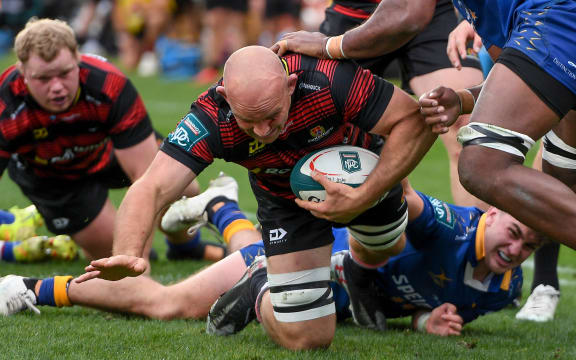 Tom Christie of Canterbury scores a try in the tackle of Joseva Tamani of Otago during the NPC and Ranfurly Shield Rugby match.