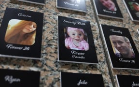 Photos of fentanyl victims  on display at The Faces of Fentanyl Memorial at the US Drug Enforcement Administration headquarters in 2022, in Arlington, Virginia.