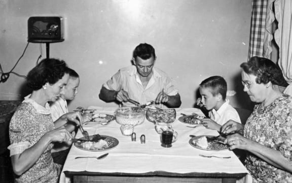 Evans family eating dinner, 1947.