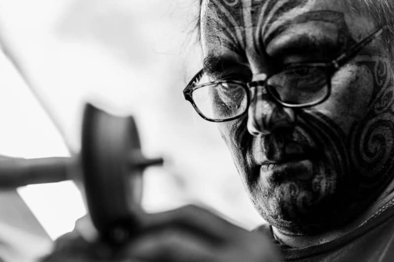 Timoti Moran working with pounamu.