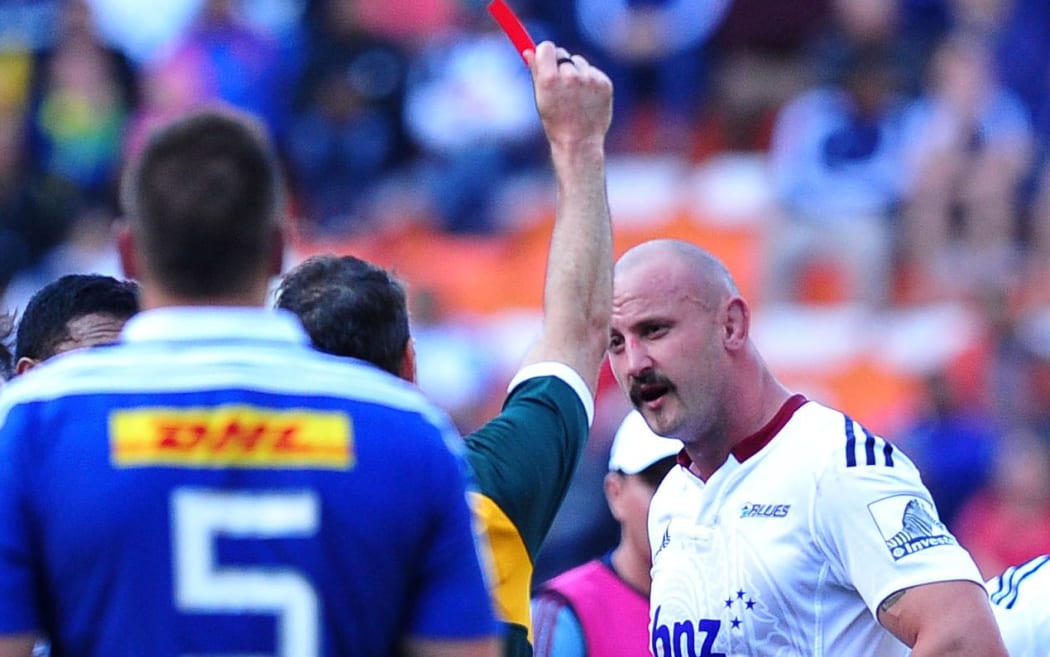 Hayden Triggs of the Blues receives a red card.