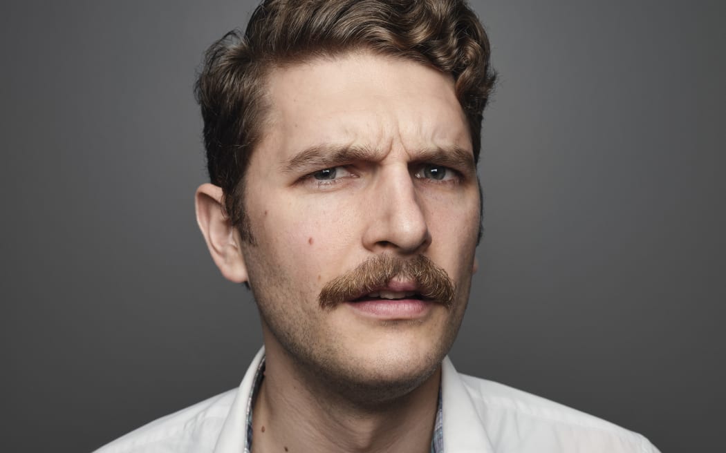 Headshot of comedian Carlo Ritchie.