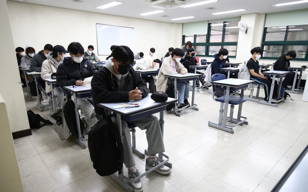 South Korean students take their annual college entrance exam at a school in Seoul on November 17, 2022.