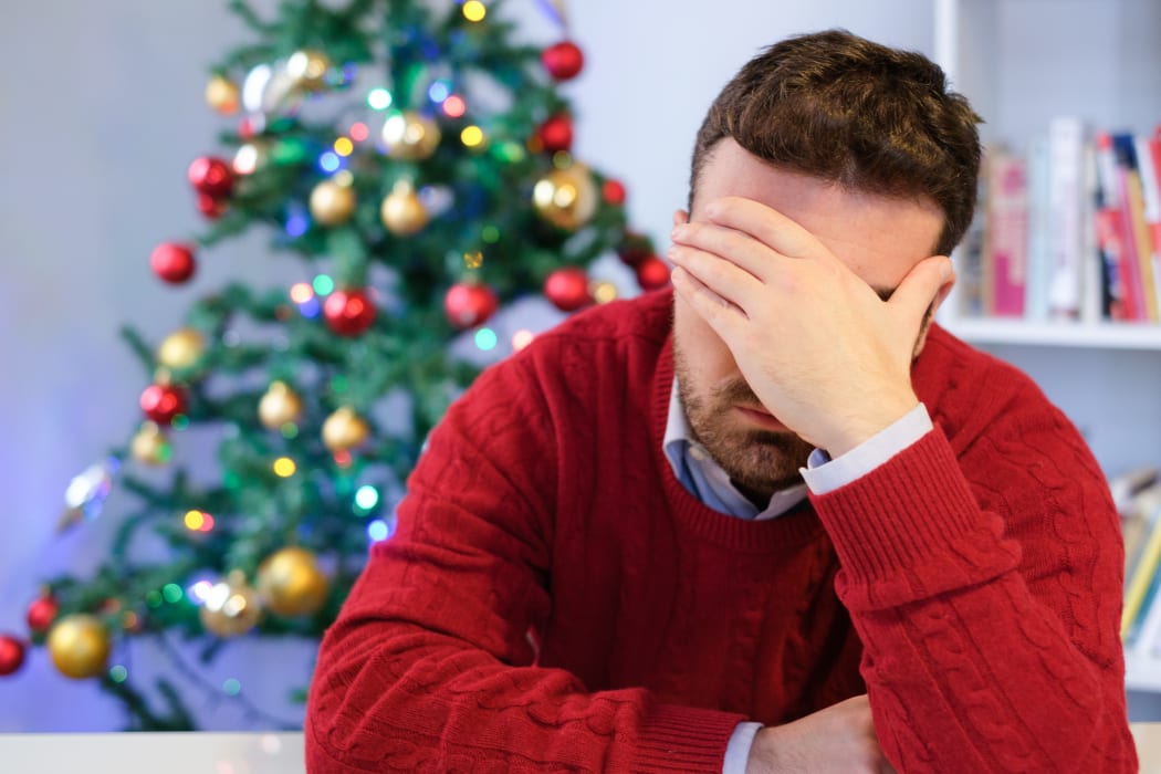 Man in solitude feeling bad during christmas day