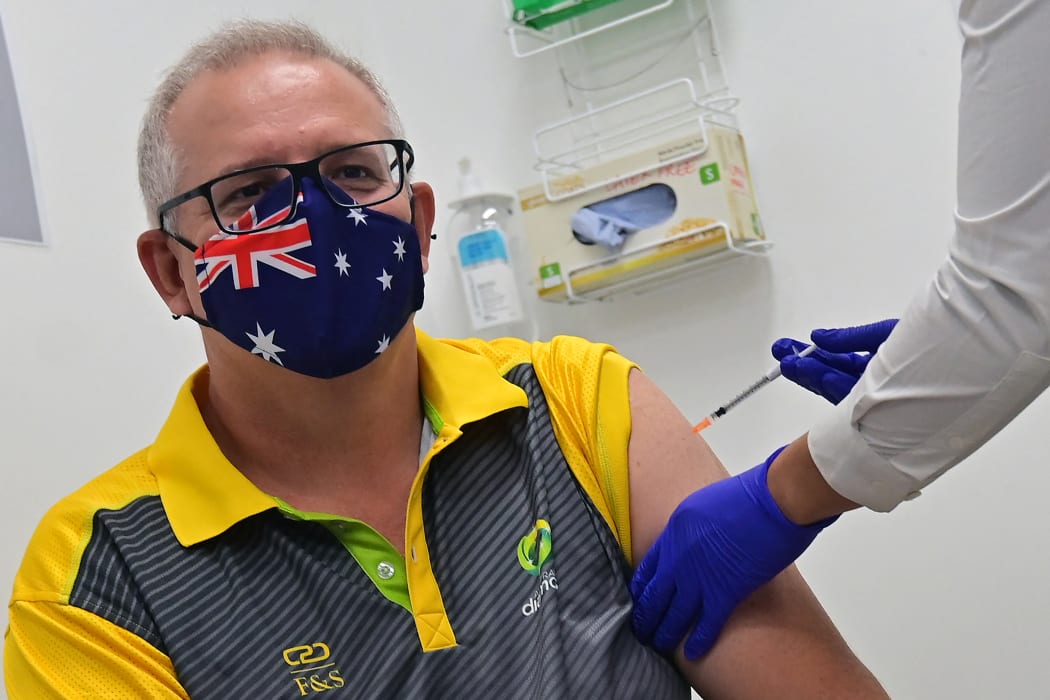 Australia's Prime Minister Scott Morrison receives a dose of the Pfizer/BioNTech Covid-19 vaccine.