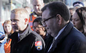 Prime Minister Chris Hipkins, Wellington Central MP and Finance Minister Grant Robertson and Wellington mayor Tory Whanau at the scene of the fire at Loafers Lodge hostel, Newtown.