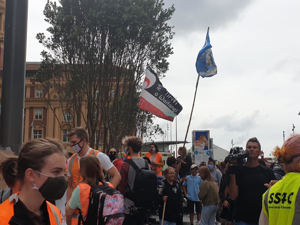 We Didn't Start The Fire playing from the truck in Auckland as flags go up.