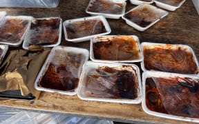 The pictures show the lunches the Whangarei school received with their packaging already coming off and burnt.