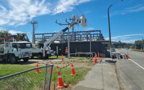 Electrical crews in hi-vis working to repair broken or damaged lines at Taradale Road switching yard.