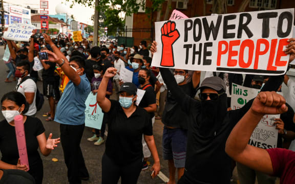 Protestors in in Colombo during a demonstration against price rises and shortages of fuel and other essential commodities, 3 April 2022.