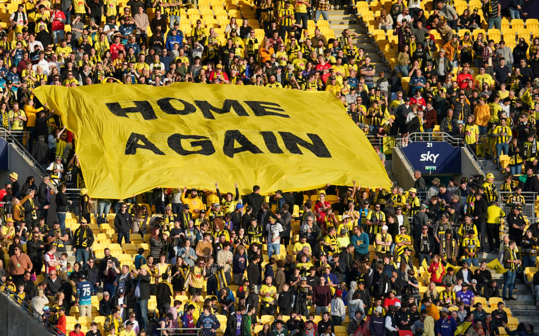 Yellow Fever fans celebrate the Phoenix's return to Wellington after the pandemic forced the team to be based in Australia for two seasons.