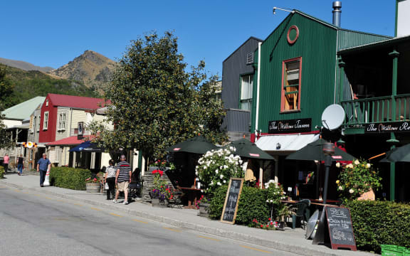 ARROWTOWN, NZ - FEB 10: Visitors in Arrowtown on February 10 2009. Arrowtown is a historic gold mining town in the Otago region of the South Island of New Zealand.