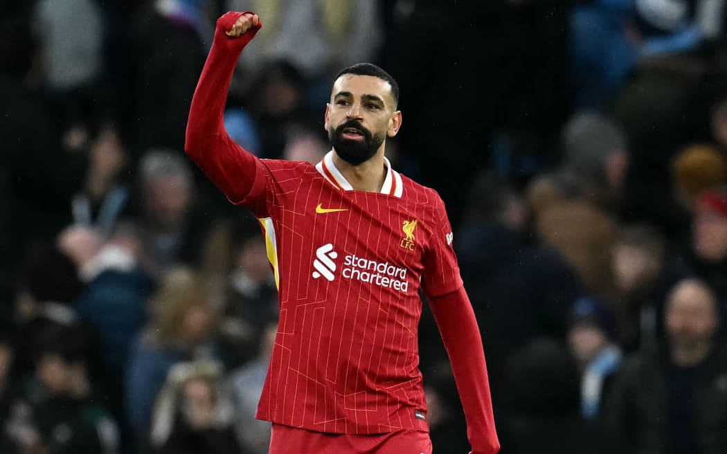 Liverpool striker Mohamed Salah celebrates scoring the opening goal against Manchester City in a Premier League clash at Etihad Stadium in Manchester, 24 Feb, 2025.
