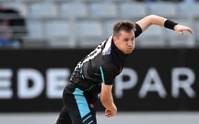 Adam Milne bowling.