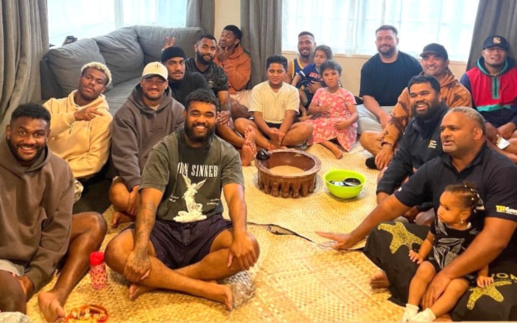 Timoci Tavatavanawai (left) with the Fijian community in Dunedin earlier this year. Fijian community leader Eric Nabalagi is on the right (black tee shirt). Photo: Supplied