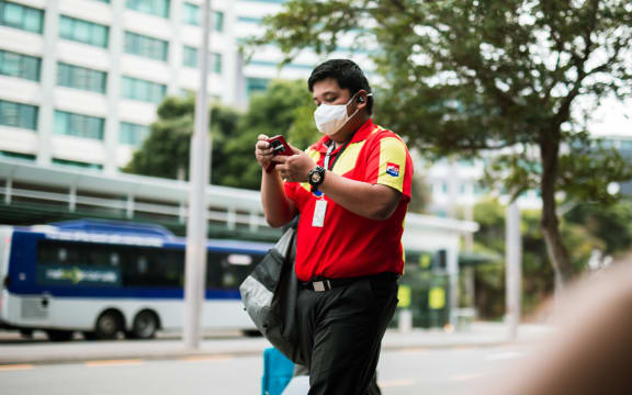 A man wears a mask during level 2 in Wellington, 15 February 20201.