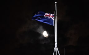 The flag is flown at half-mast at Parliament building following the terrorist shooting in Christchurch.