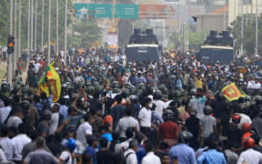 Sri Lankan anti-government and pro-government protesters clash near the president's office at Colombo, Sri Lanka.