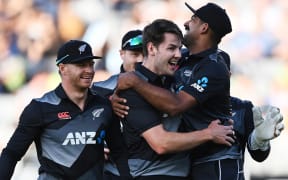 Ish Sodhi celebrates with Jacob Duffy after his wicket of Adbuuah Shafique. New Zealand Black Caps v Pakistan. International Twenty20 Cricket. Eden Park, Auckland, New Zealand. Friday 18 December 2020. © Copyright Photo: Andrew Cornaga / www.photosport.nz