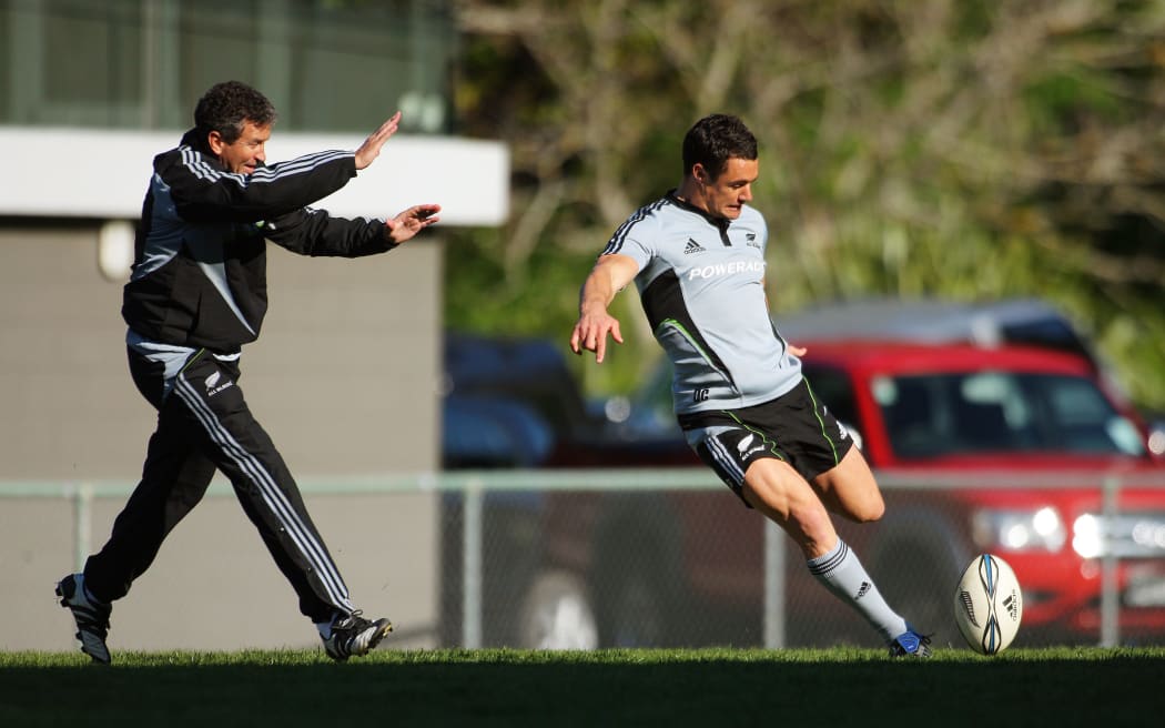 Dan Carter practices dropkicking for goal under pressure from backs coach Wayne Smith in 2009. All Blacks Training Session at Rugby League Park, Newtown, Wellington.